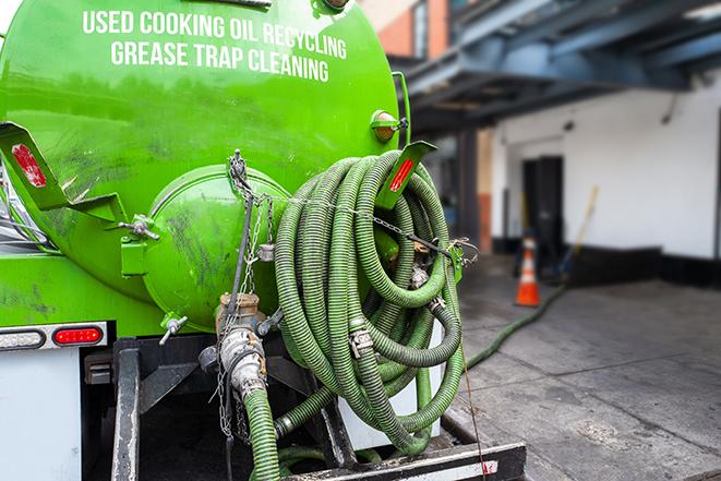 a grease trap pumping truck at a restaurant in Buchanan